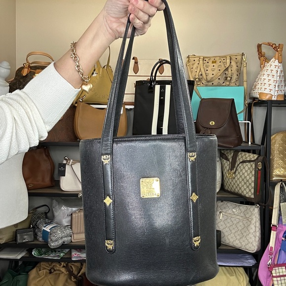 MCM Handbags - MCM Munchen Black Leather Tote with Gold Logo Plaque COA